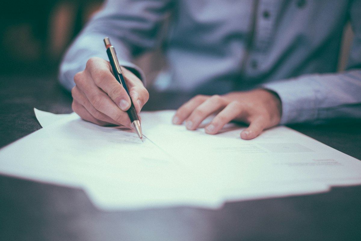Client reviewing and signing paperwork